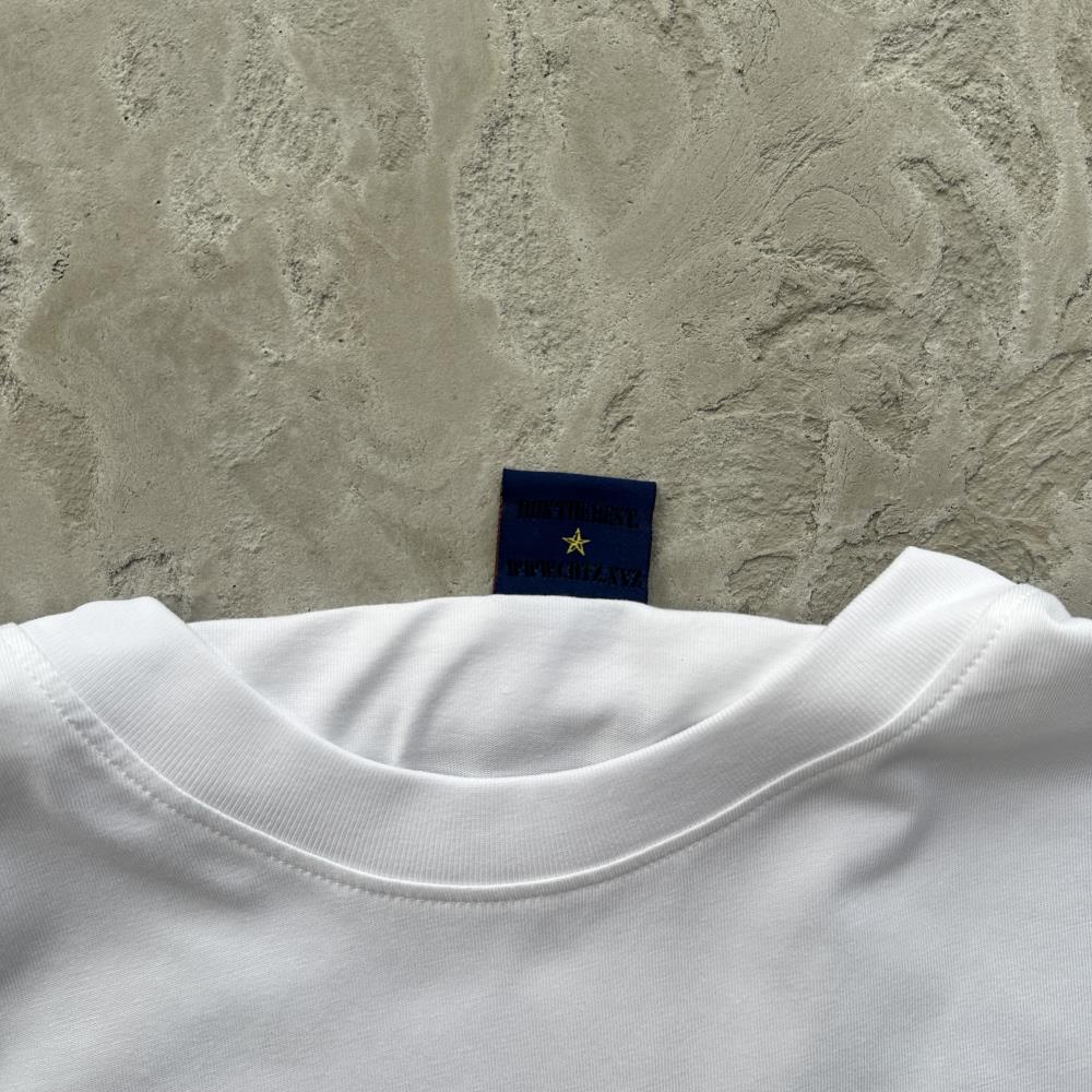 flying man statue tee