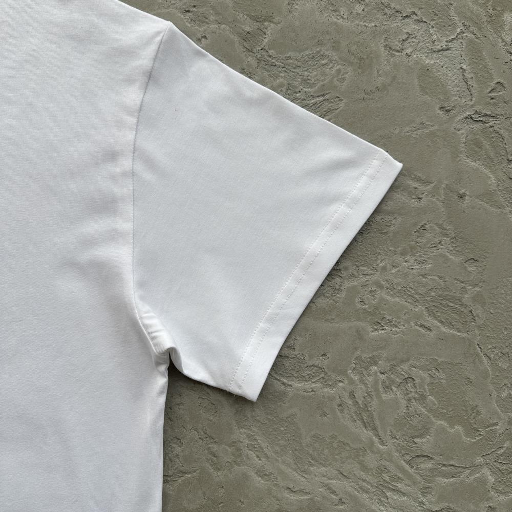 flying man statue tee