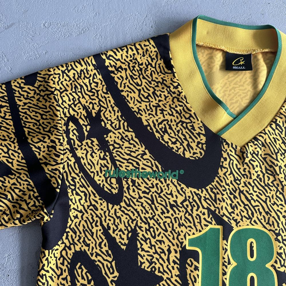 yellow and black all-over printed football uniform