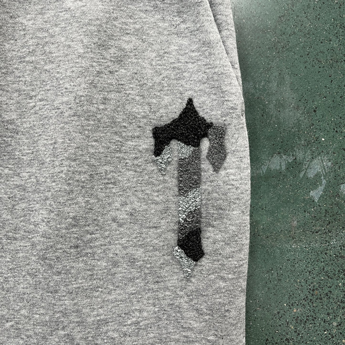 T word black and gray suit